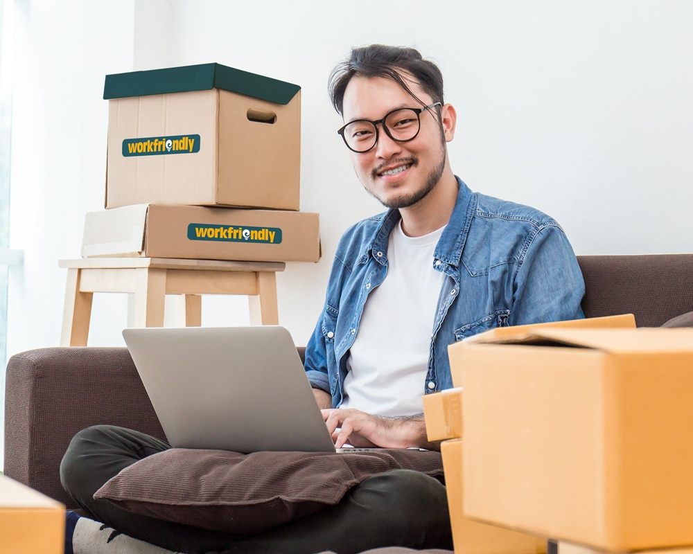 man on couch with boxes