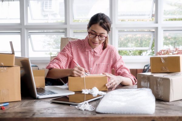 woman packaging orders