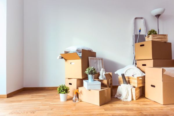 boxes piled up in one corner of the room