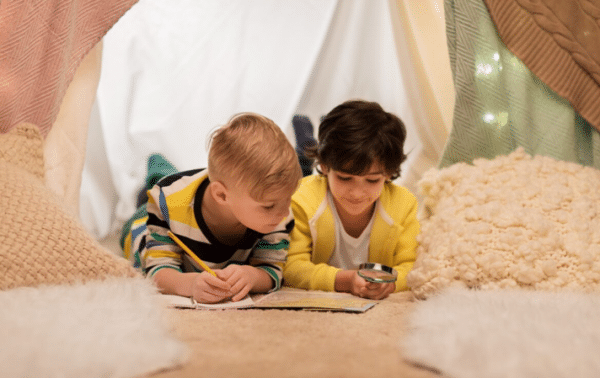 kids playing in blanket fort