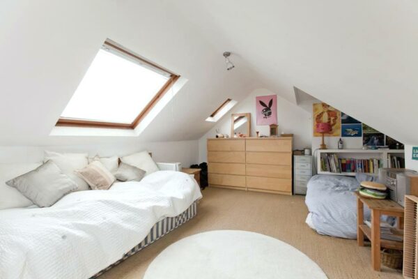 a small dormer bedroom in the attic