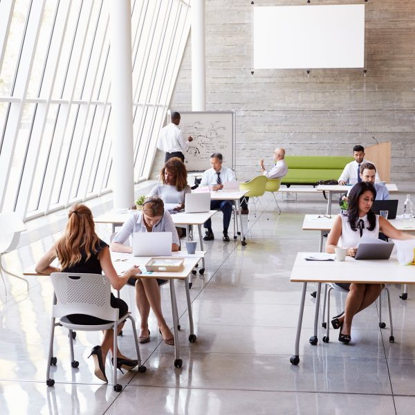 busy professionals sharing a co-working space