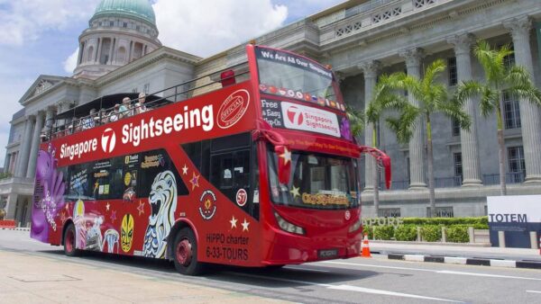 A red bus touring Singapore