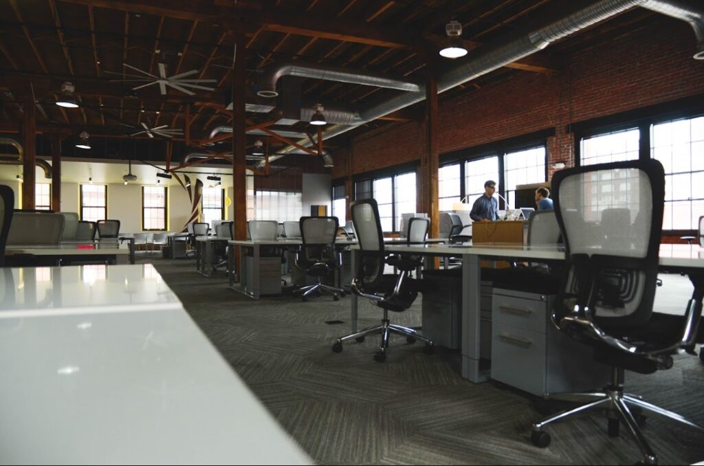Spacious coworking space in Singapore with modern desks, ergonomic chairs, and open office layout ideal for professionals using a flexible day pass setup.