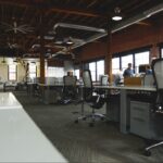 Spacious coworking space in Singapore with modern desks, ergonomic chairs, and open office layout ideal for professionals using a flexible day pass setup.
